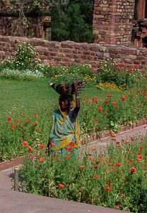 A woman tends the garden at Gandhi’s historic home, now a museum.